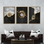 tableau abstrait relief triptyque noir blanc et or avec motifs concentriques texturés modernes